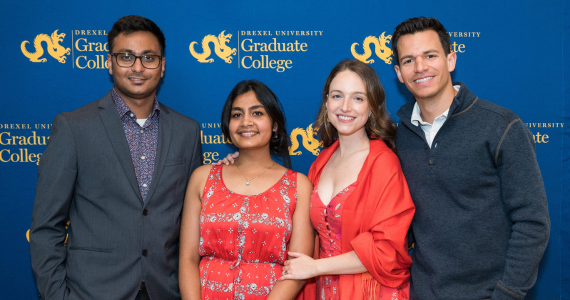 Photo of graduating PhD students and their families at the 2023 Doctoral Student Celebration